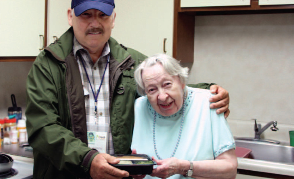 Senior having Meals on Wheels Volunteers deliver a healthy meal.