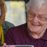 Maple Ridge Pitt Meadows Community Services Senior Navigation and Peer Support Services Program. Senior being helped.